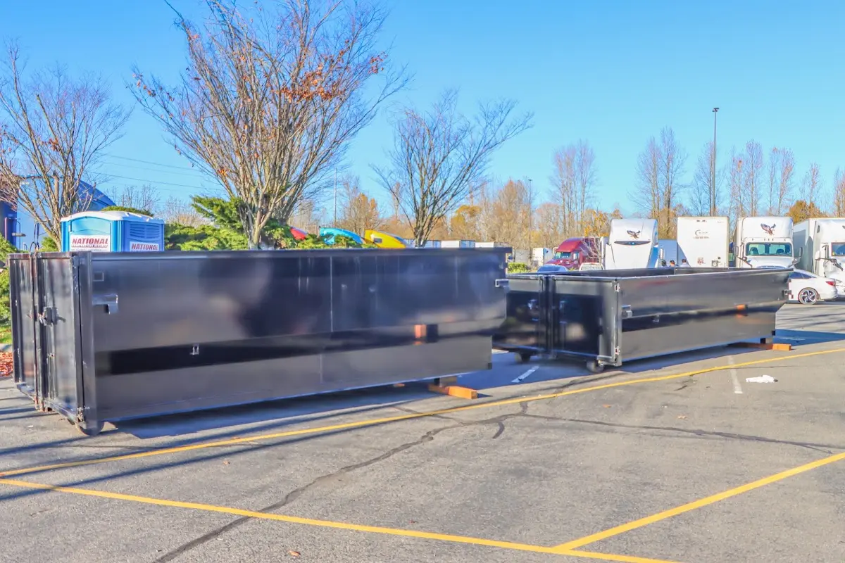 Professional dumpster rental service with roll-off container on residential driveway in Dentsville